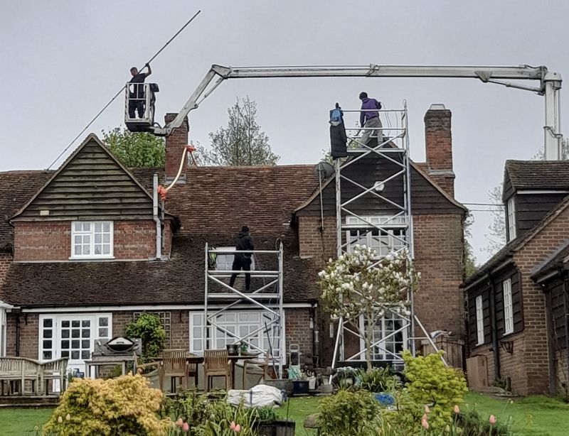 The Roof Moss Cleaners using cherry picker and scaffolding to clean roof safely and professionally in Sunningdale, Berkshire